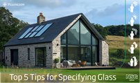 House with big glass facade and Pilkington logo overlayed